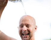 man cooling himself down with water